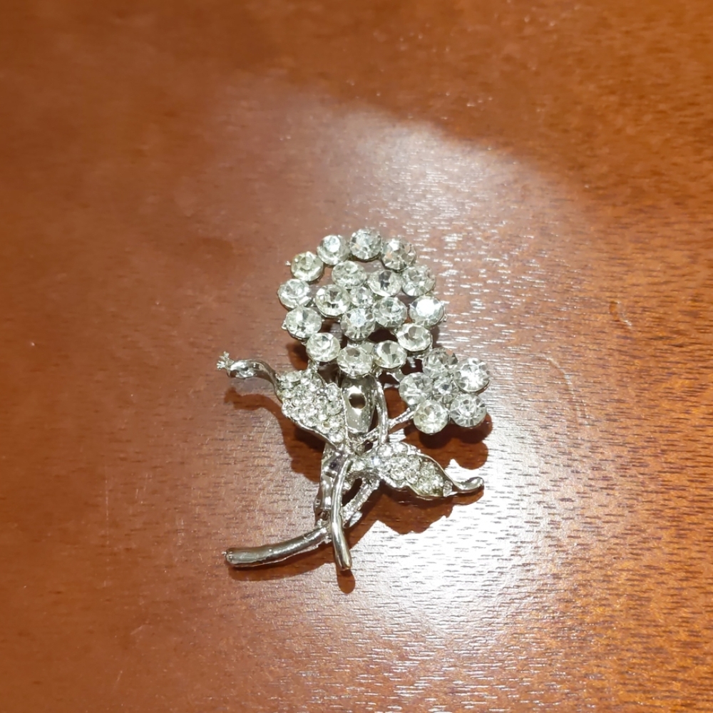 Silver  and rhinestone floral broach
